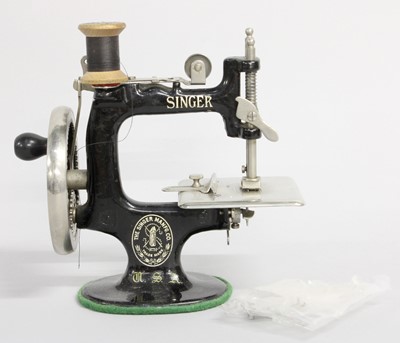 Lot 2044 - Miniature Singer Sewing Machine, with three...