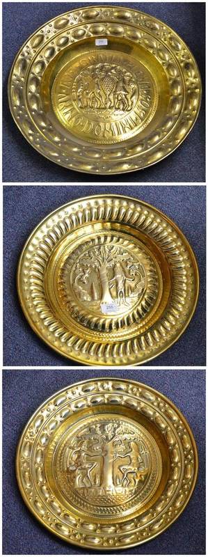 Lot 255 - A Nuremberg Gilt Brass Large Alms Dish, late 19th century, centrally embossed with a pair of...