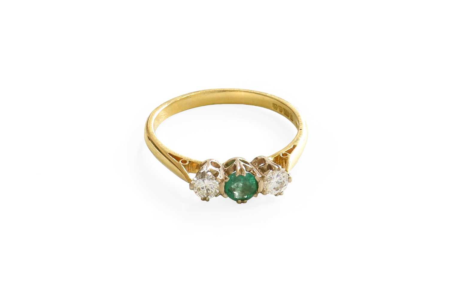 Lot 1016 - An 18 Carat Gold Emerald and Diamond Ring, the...