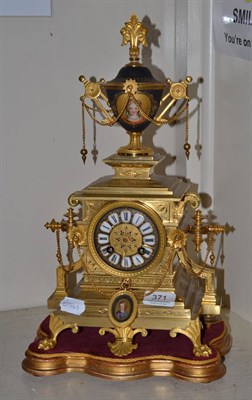 Lot 371 - An Aird & Thompson Swiss ormolu clock with pendulum and key