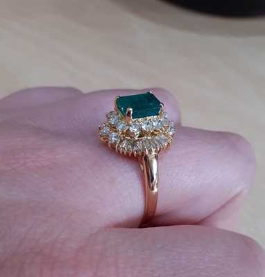 Lot 2100 - An 18 Carat Gold Emerald and Diamond Cluster...