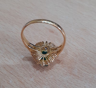 Lot 2100 - An 18 Carat Gold Emerald and Diamond Cluster...