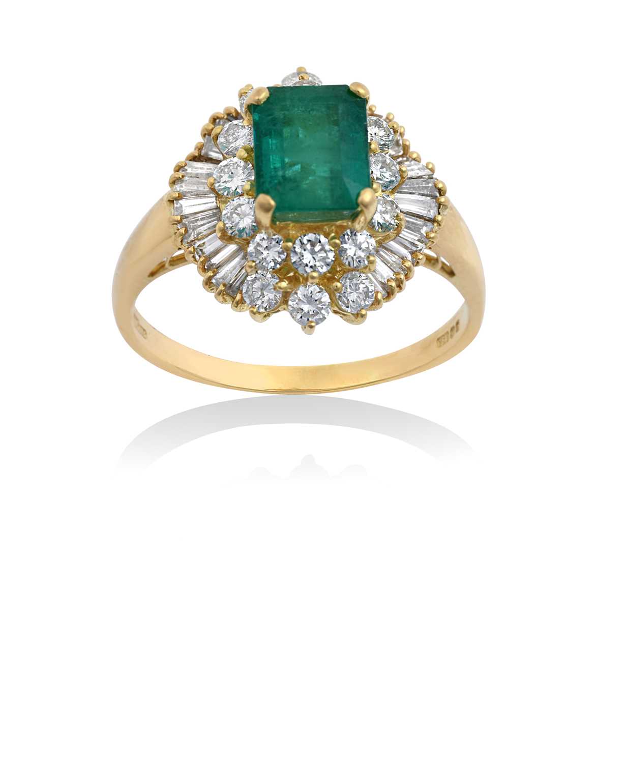 Lot 2100 - An 18 Carat Gold Emerald and Diamond Cluster...
