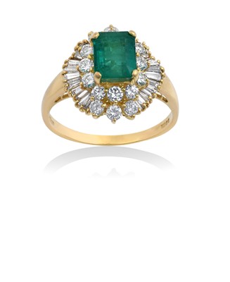 Lot 2100 - An 18 Carat Gold Emerald and Diamond Cluster...