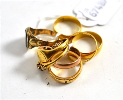 Lot 382 - Three 22ct gold wedding bands, a 9ct gold wedding band and five various other gold rings