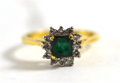 Lot 390 - An 18ct gold emerald and diamond cluster ring