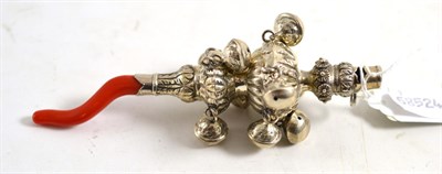 Lot 393 - A silver and coral rattle