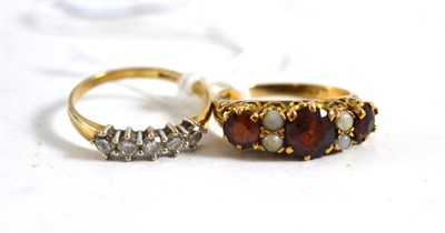 Lot 399 - A 9ct gold five stone diamond ring and a 9ct gold garnet and cultured pearl ring (a.f.) (2)