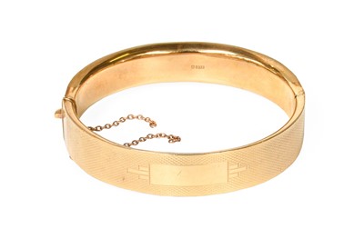 Lot 1064 - A 9 Carat Gold Hinged Bangle, inner...