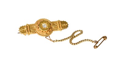 Lot 1052 - A 15 Carat Gold Diamond Brooch, with locket...