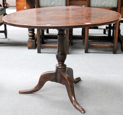 Lot 1160 - An 18th Century Oak Plank Top Tripod Table,...