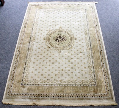 Lot 1210 - A Machine Made Carpet, the cream field with...