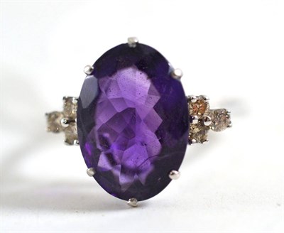 Lot 411 - 14ct white gold amethyst and diamond ring, finger size N