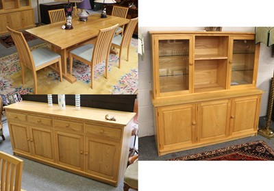 Lot 1316 - A Treske Light Oak Dining Suite, comprising -...