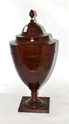 Lot 261 - A Mahogany Cutlery Urn, in George III style, with ovoid finial, over a rising lid with...