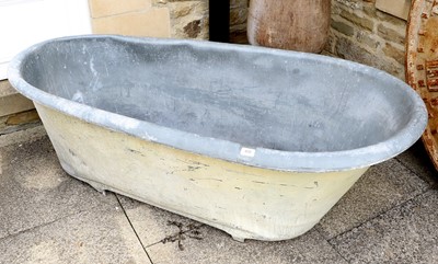 Lot 408 - A Zinc Rolled Slipper Shaped Bath 18cm by 73cm...