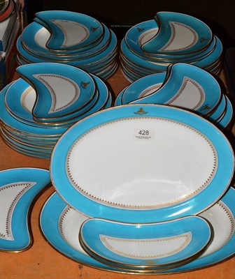 Lot 428 - A Minton part dinner service the turquoise and gilt borders bearing a family crest (possibly...