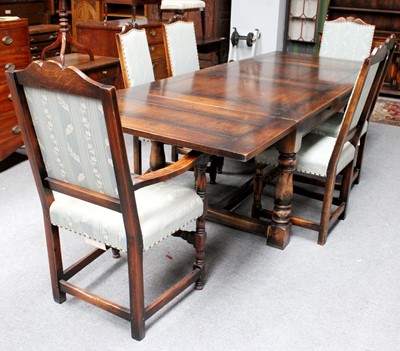 Lot 1155 - A 20th Century Oak Dining Table, the drawleaf...