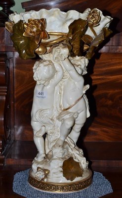 Lot 441 - Late 19th century Moore centrepiece modelled as two putti below flower baskets (a.f.), 46cm high