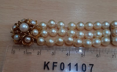 Lot 2086 - A Triple Row Cultured Pearl Bracelet, with A 9...