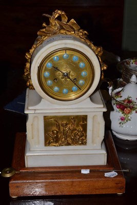 Lot 451 - A white marble mantel clock with blue Roman numerals, with wooden base, key and pendulum