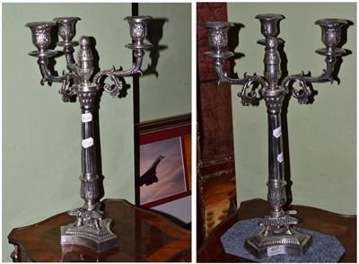 Lot 457 - A pair of silver plated three branch candelabra in the Regency style