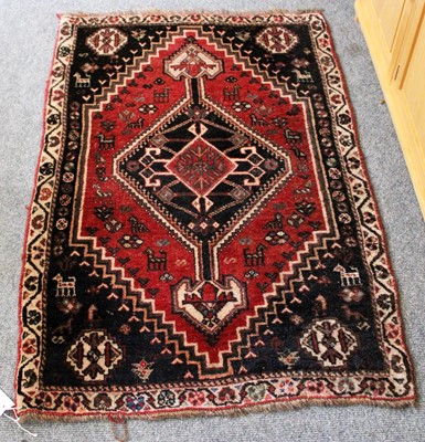 Lot 1216 - A Kashgai Rug, the raspberry field of animals...