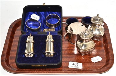 Lot 463 - A cased pair of silver pepperettes, a pair of silver pepperettes, a small silver pepperette, a pair