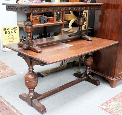 Lot 1140 - An Oak Extending Dining Table, with moulded...