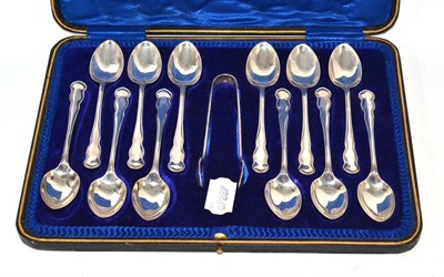 Lot 484 - A set of twelve silver teaspoons, Sheffield 1911, with a pair of plated sugar tongs