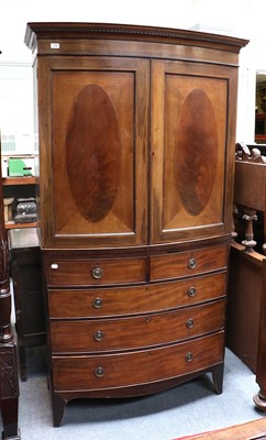 Lot 1199 - A Mahogany Bow Front Linen Press, early 19th...