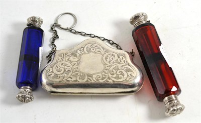 Lot 490 - A cranberry glass double ended scent bottle with plated covers, a similar blue glass double...