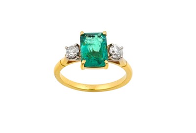 Lot 2144 - An Emerald and Diamond Three Stone Ring the...