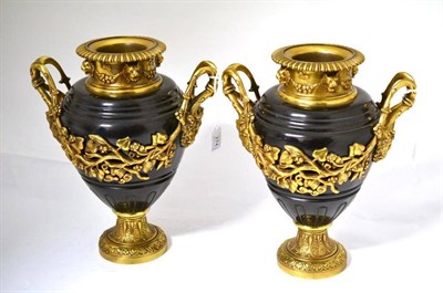 Lot 274 - A Pair of Ormolu Mounted Twin-Handled Urn Shaped Vases, the necks with lion masks hung with...