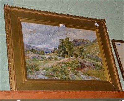 Lot 554 - John Hodgson Campbell (1855-1927) Stone pack horse bridge, probably Cumbria, signed,...