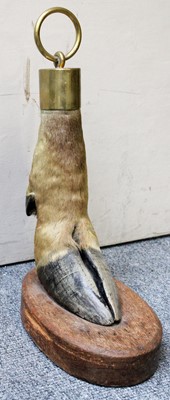 Lot 1199 - A Camel Leg Doorstop