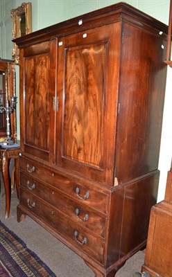 Lot 598 - An early 19th century mahogany linen press