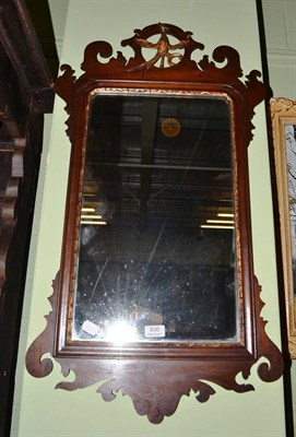 Lot 606 - A mahogany fret cut mirror