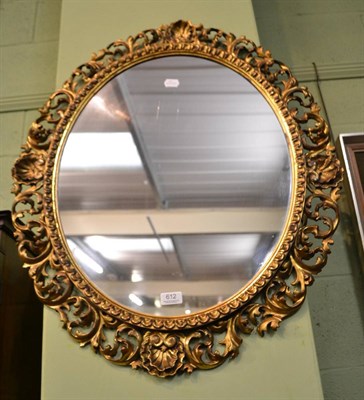 Lot 612 - An oval wall mirror in a gilt Florentine style frame