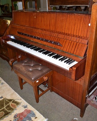 Lot 620 - A mahogany upright piano with overstrung iron frame by August Forster with piano stool