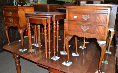 Lot 628 - A reproduction mahogany nest of tables and a pair of bedside cabinets