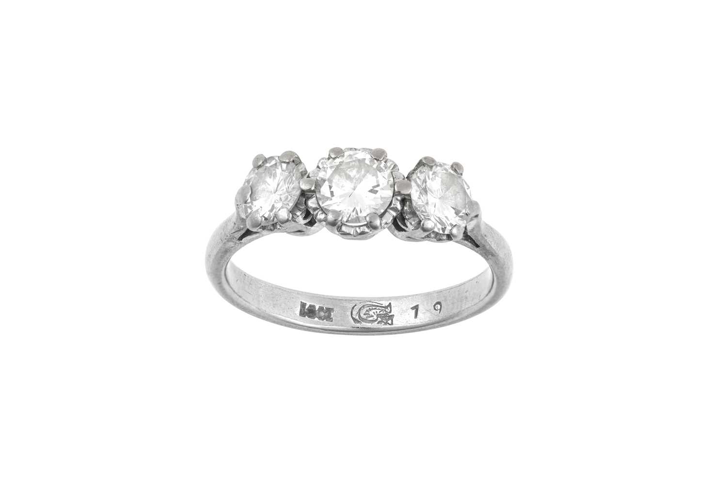 Lot 2008 - A Diamond Three Stone Ring the round brilliant...