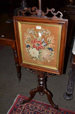 Lot 646 - A Victorian rosewood pole screen with woolwork banner