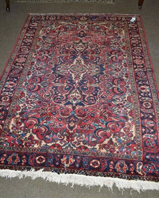 Lot 647 - Lillihan Rug, West Persia, the strawberry field centred by an indigo floral medallion framed by...