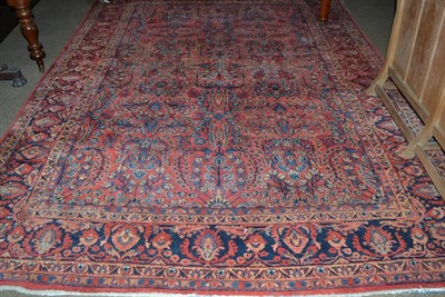 Lot 648 - A small Eastern carpet with crimson field filled with palmettes