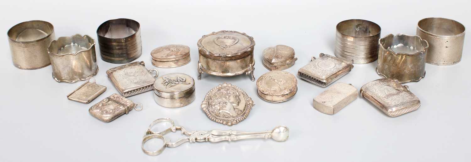 Silver Collection Display Lot 9 - A Collection of Assorted Silver, including