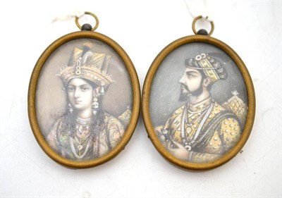 Lot 284 - A Pair of Indian Oval Portrait Miniatures, 19th century, painted with bust portraits of a...