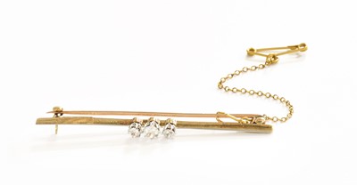 Lot 175 - A Diamond Three Stone Bar Brooch, the...