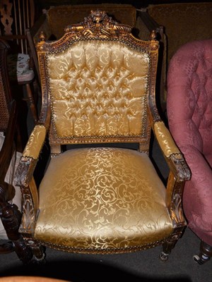 Lot 658 - A giltwood open armchair upholstered in gold damask