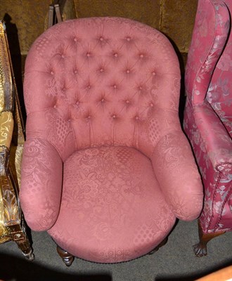 Lot 659 - A Victorian walnut framed button back armchair